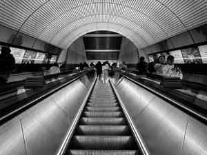 a black and white high contrast photograph taken on the escalator at Whitechapel station.
