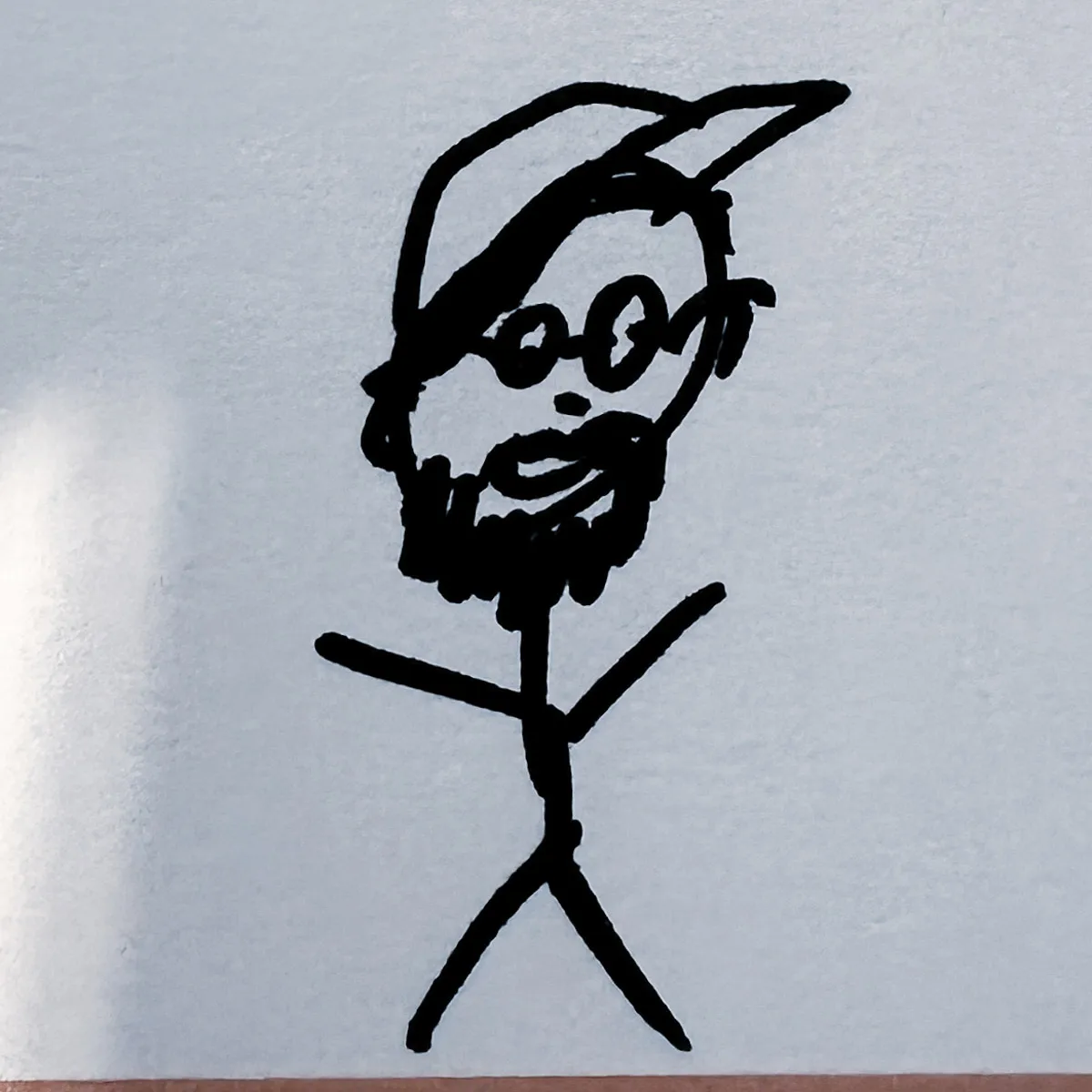 a stick man sketch of me with beard, glasses and a peaked hat.